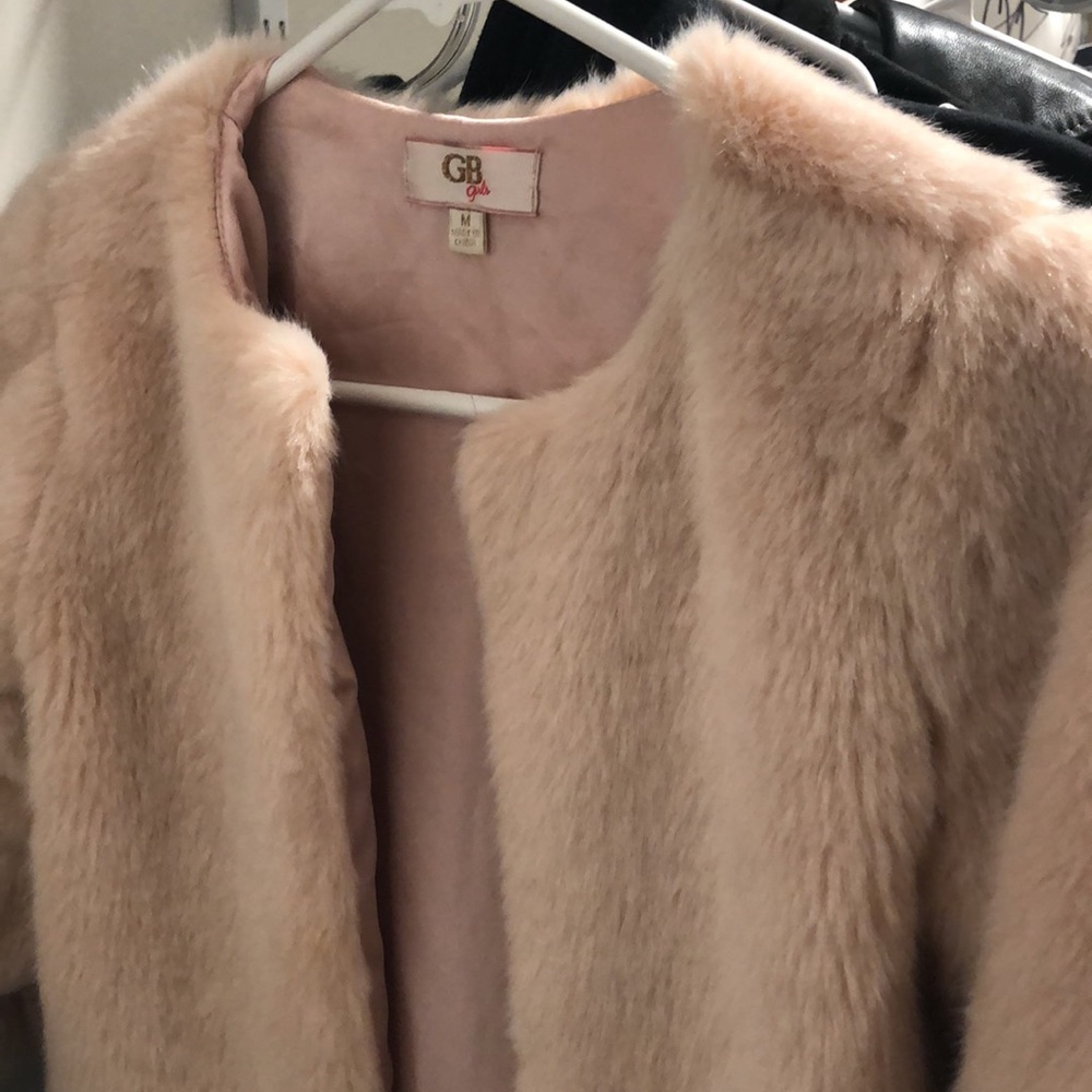 Beautiful young girls shrug in pink faux fur